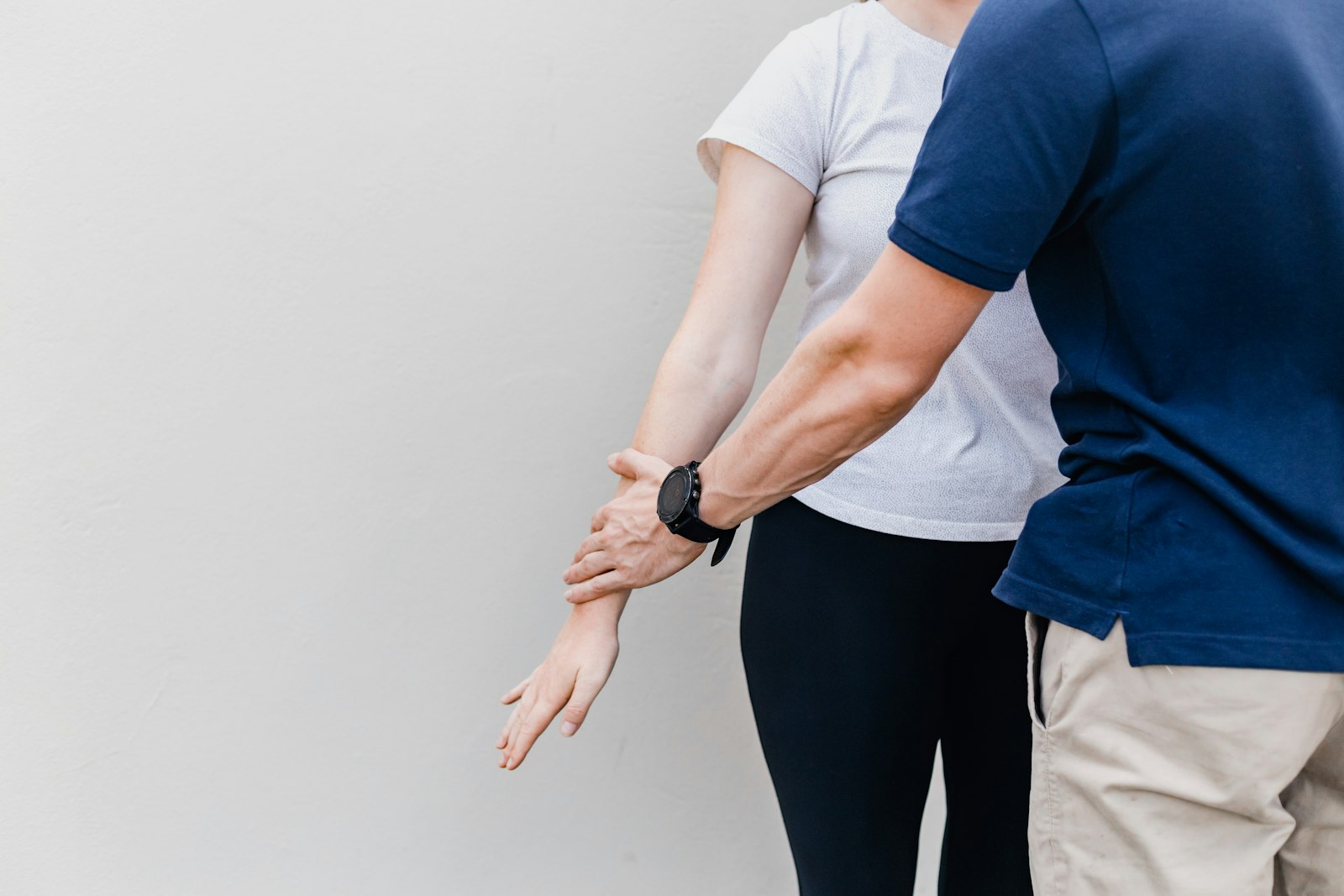 Physiotherapist working with a patient on balance and standing practice